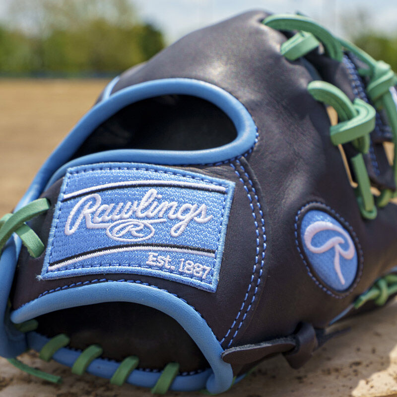 Picture of the Columbia blue Rawlings patch on a navy exclusive Rawlings NXT Series 11.5" infield glove loading=
