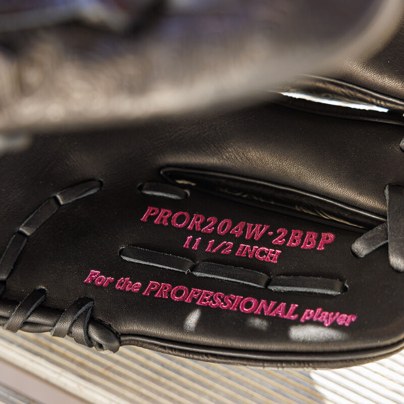 Picture of the pinky stamp on a black Rawlings R2G Heart of the Hide 11.5" glove