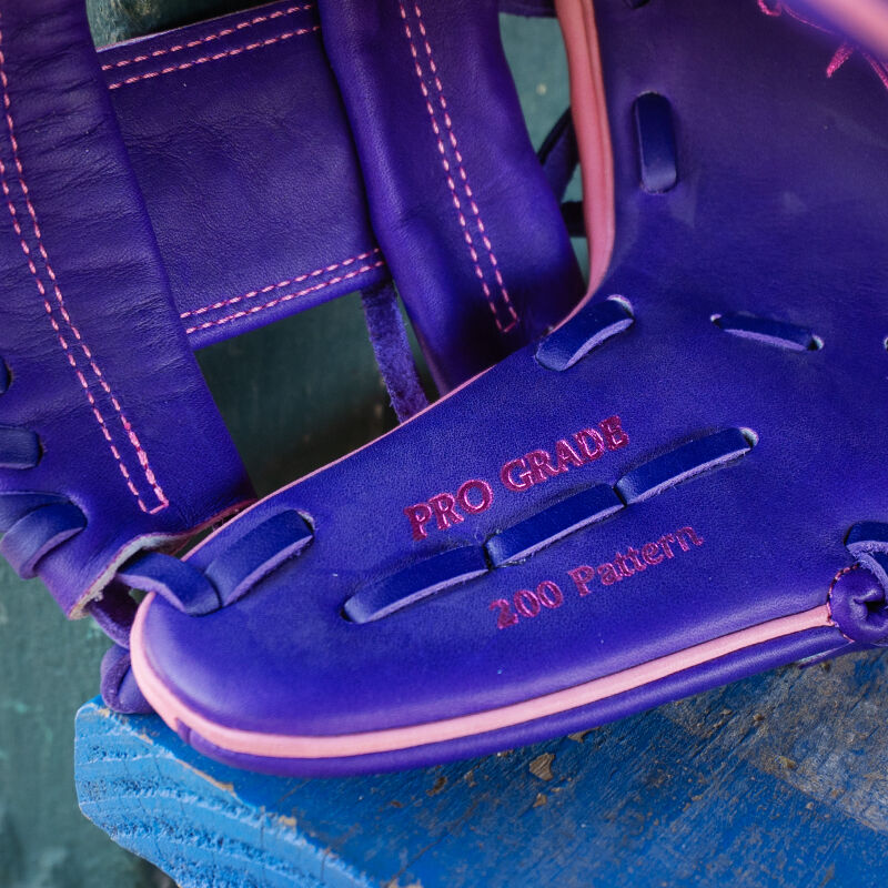 Picture of the thumb stamp on a Rawlings exclusive 11.5" R2G Heart of the Hide pink/purple infield glove