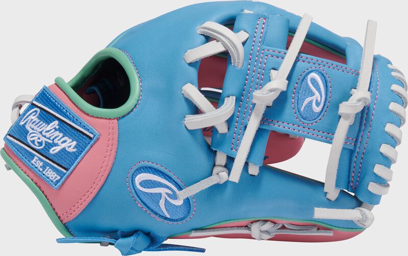Columbia blue thumb of an Exclusive Rawlings NXT Series 11.5" Infield Glove with a columbia blue I-web loading=