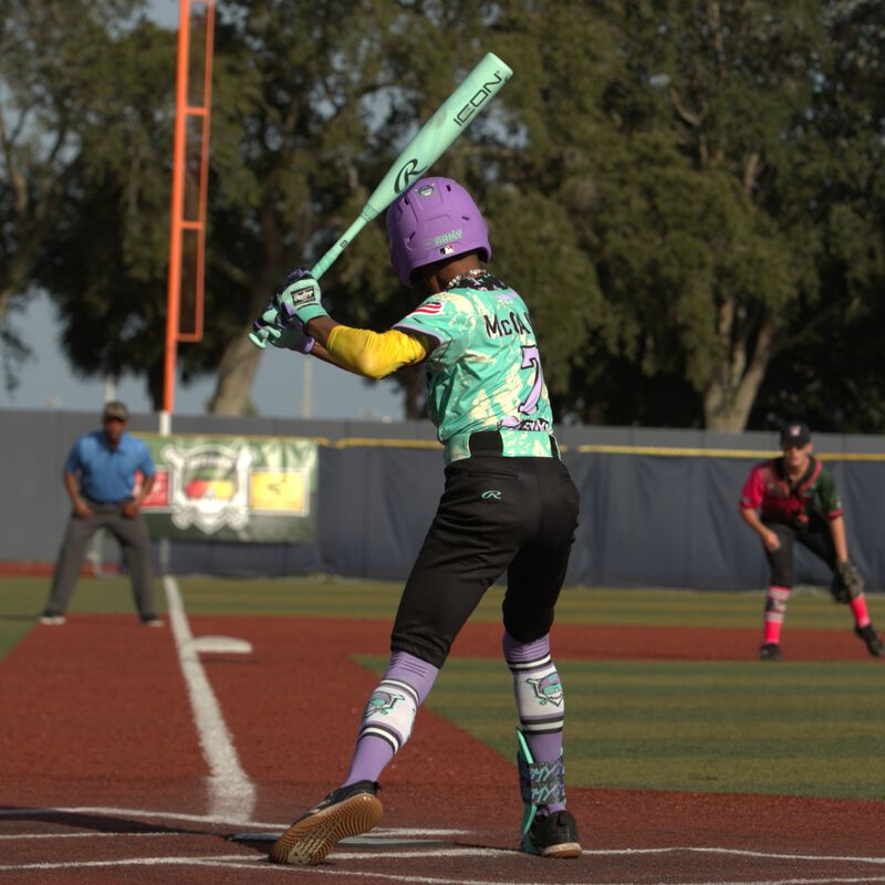 A player batting with a 2026 Rawlings Icon USSSA baseball bat loading=