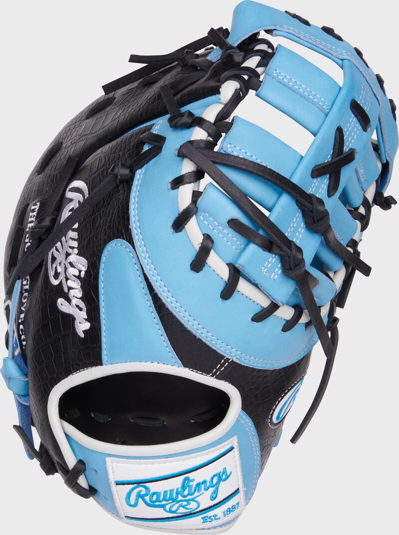 Black back of a 12.5" Heart of the Hide first base mitt with a white/Columbia blue Rawlings patch