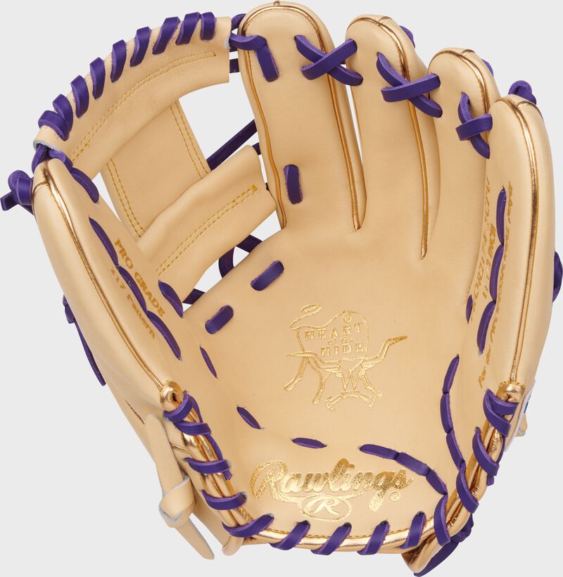 Camel palm of a J.P. Crawford Heart of the Hide Infield Glove with purple laces