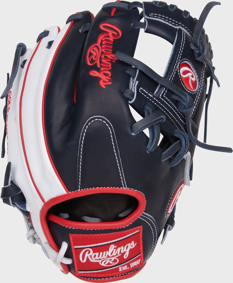 Navy/White back of a Heart of the Hide ContoUR fit 11.5" infield glove with a red Rawlings patch