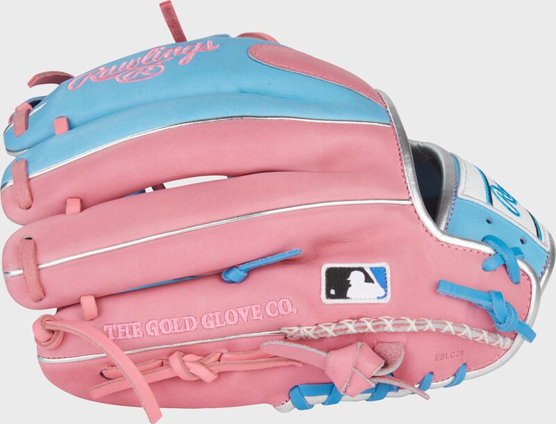 Back of a Columbia blue/pink Heart of the Hide 11.5" infield glove with the MLB logo on the pinky