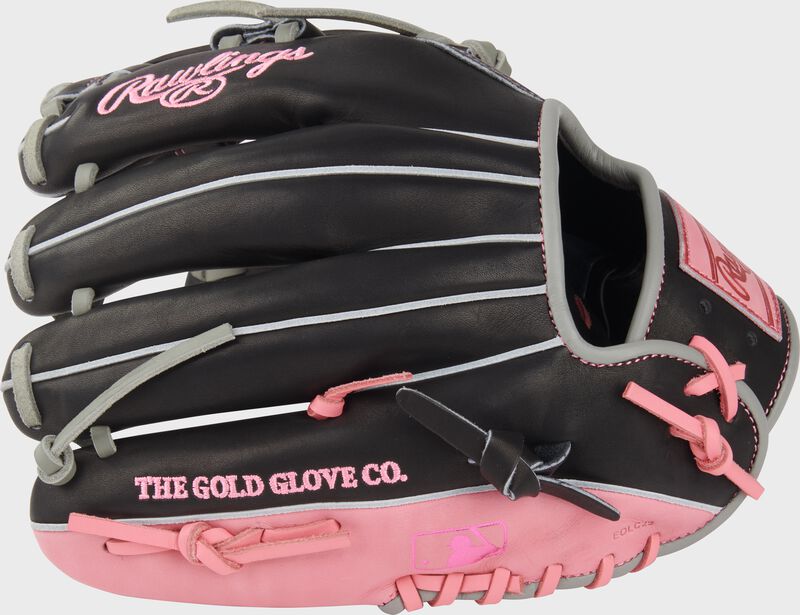 Back of a black/pink Rawlings Heart of the Hide Broken Heart 11.5" glove with the MLB logo on the pinky