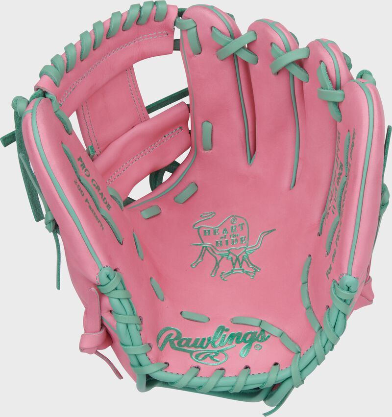 Palm of a Heart of the Hide Vibrant Series pink 11.5" infield glove with mint laces