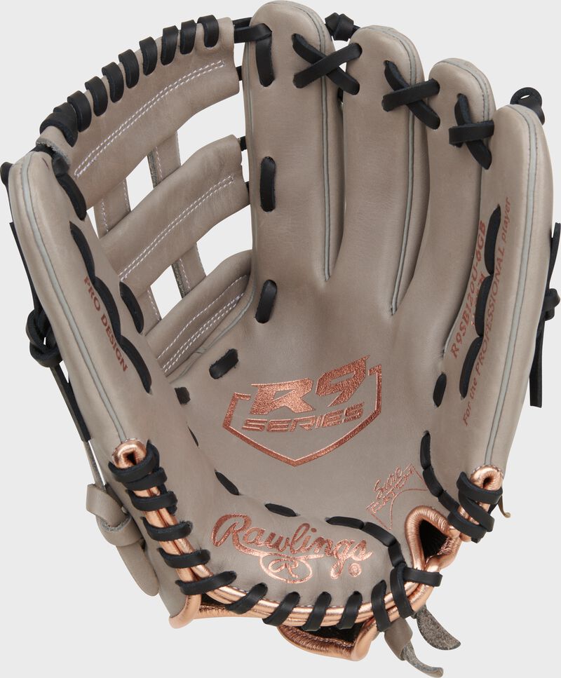 Gray palm of a Rawlings R9 Series fastpitch glove with rose gold stamping and black laces