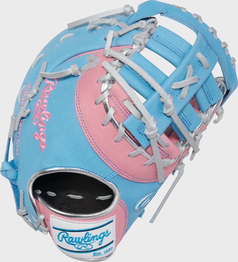 Back of a pink/columbia blue Heart of the Hide R2G 13" 1st base mitt with a white/columbia blue Rawlings patch