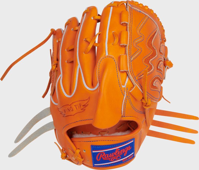 Back of an orange Rawlings Heart of the Hide Japan Series 11.75" glove