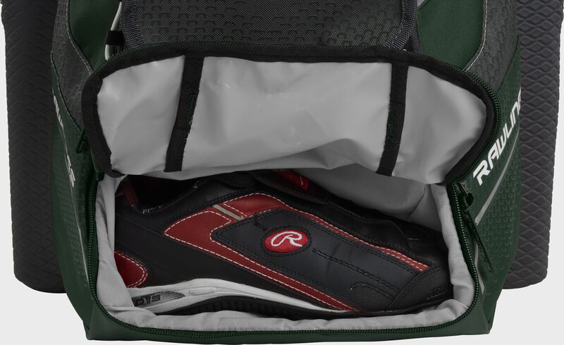 A dark green Rawlings baseball backpack with a cleat in the bottom cleat storage compartment - SKU: IMPLSE-DG