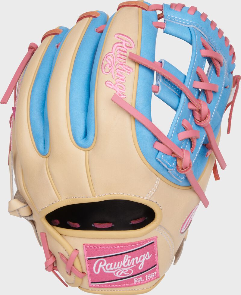 Back of a camel/Columbia blue Heart of the Hide 11.5" infield glove with a pink Rawlings patch