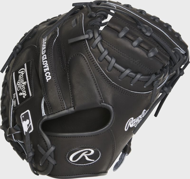 Back of a black Heart of the Hide R2G 33" catcher's mitt with a black Oval R on the wrist strap - SKU: RSGPROCM33B