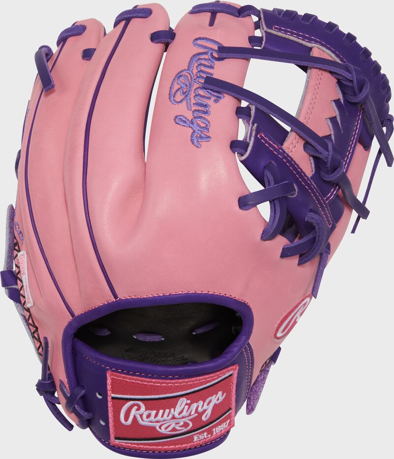 Pink back of a Rawlings Exclusive Heart of the Hide R2G Purple/Pink 11.5-inch Infield Glove with a pink Rawlings patch