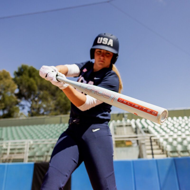 A picture of Haylie McCleney swinging a 2025 Ghost Unlimited fastpitch bat