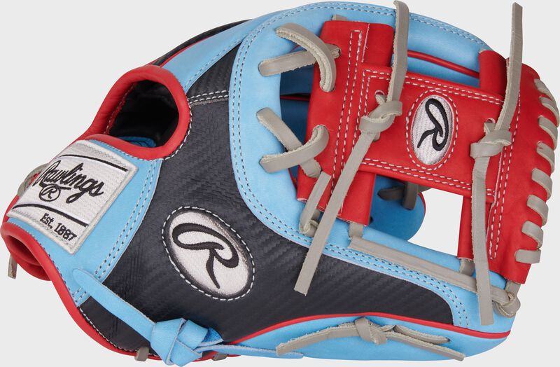 Thumb of a Columbia blue/black Heart of the Hide Hyper Shell 11.5" infield glove with a Scarlet I-web