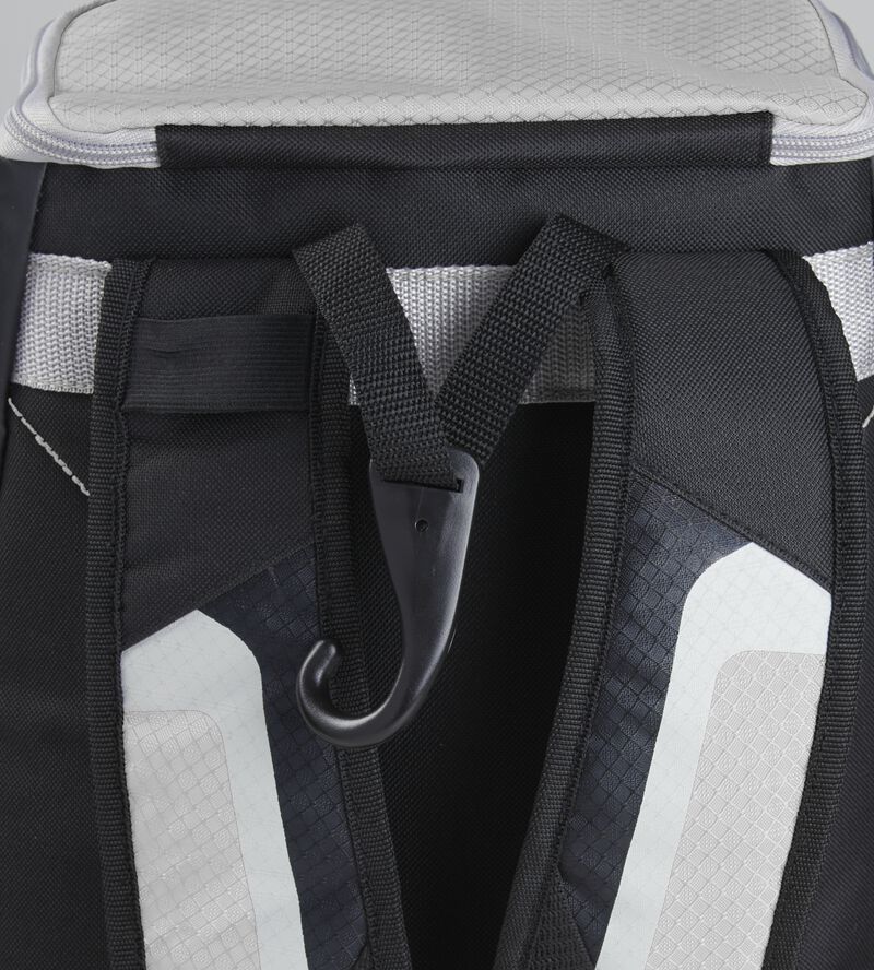 Exterior handle on the back of a black/white R500 backpack with a hook for hanging it up