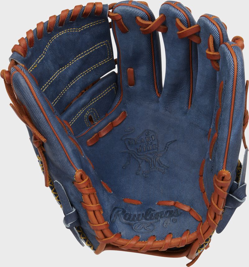 Palm of a Rawlings Heart of the Hide Pro Label Denim Infield/Pitcher's Glove with tan laces
