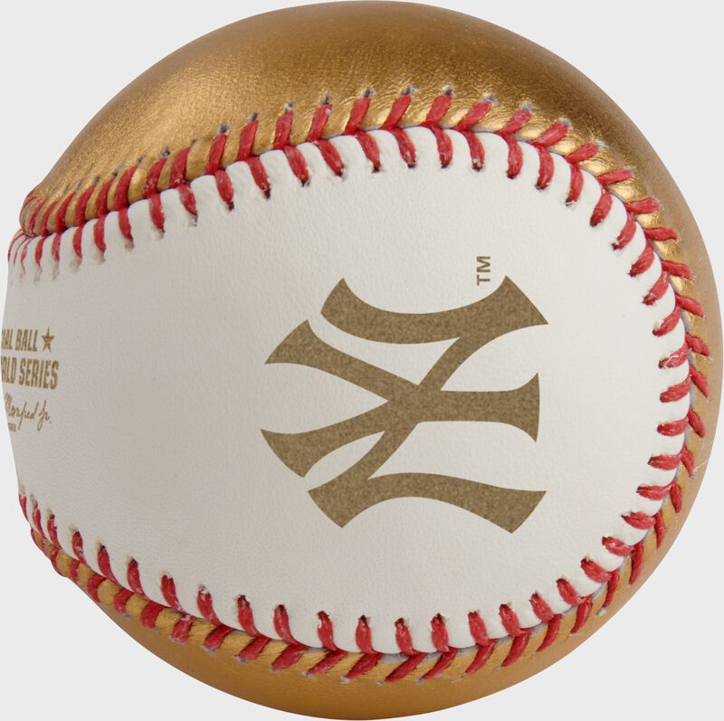A gold New York Yankees logo stamped on a white side of a Rawlings MLB 2024 World Series dueling baseball