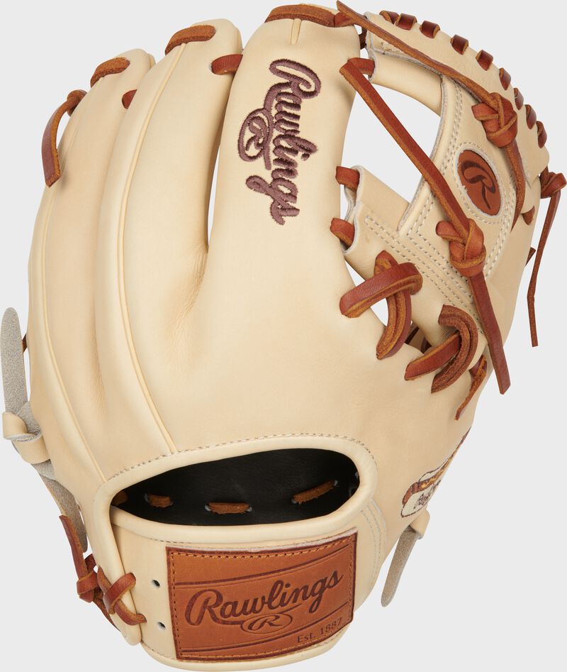 Back of a camel Heart of the Hide 11.5" Hot Dog infield glove with a tan leather Rawlings patch loading=
