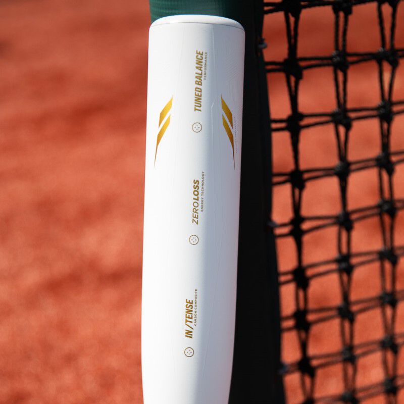 White barrel with gold tech callouts on the barrel of an Icon USSSA bat on a field - SKU: RUT4I loading=