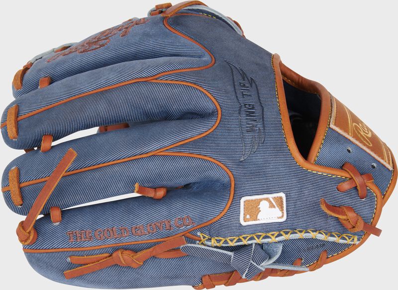 Back of a Heart of the Hide Pro Label Denim Infield/Pitcher's Glove with the MLB logo on the pinky