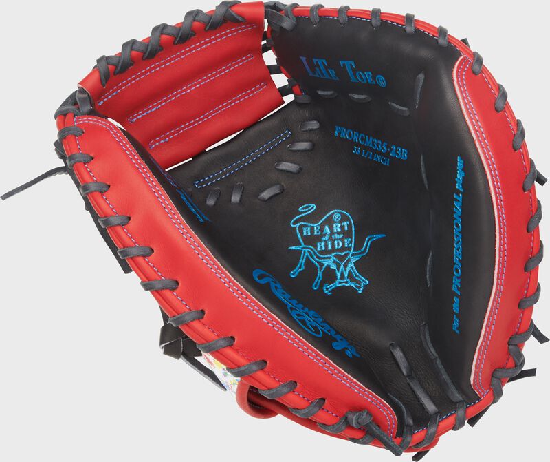 Black palm of a Heart of the Hide 33.5-Inch Splatter Catcher's Mitt with Columbia blue stamping and black laces