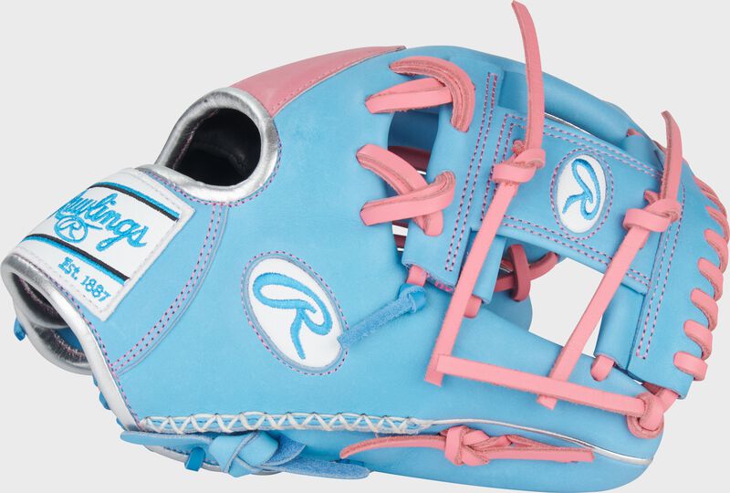 Thumb of a Columbia blue/pink Heart of the Hide 11.5" infield glove with a Columbia blue I-web