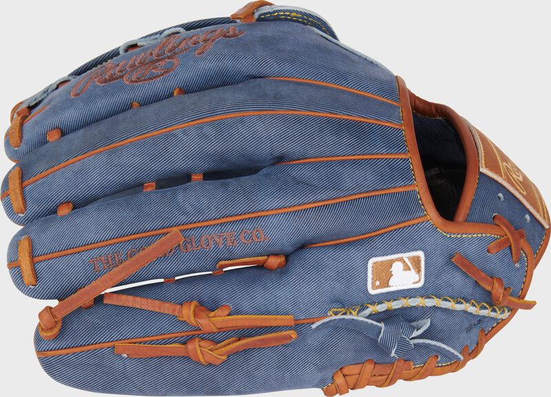 Back of a Heart of the Hide Pro Label Denim outfield glove with the MLB logo on the pinky