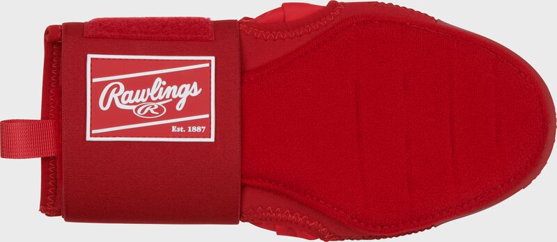 Palm of a scarlet Rawlings sliding mitt with a red Rawlings patch logo on the wrist cuff