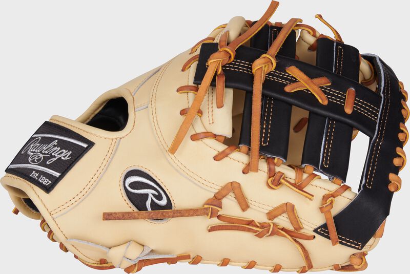 Camel thumb of a Heart of the Hide 13" first base mitt with a black single post, double bar web