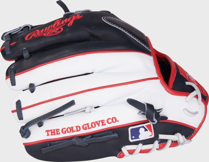 White/navy back of a Heart of the Hide 11.5" ContoUR fit infield glove with the MLB logo on the pinky
