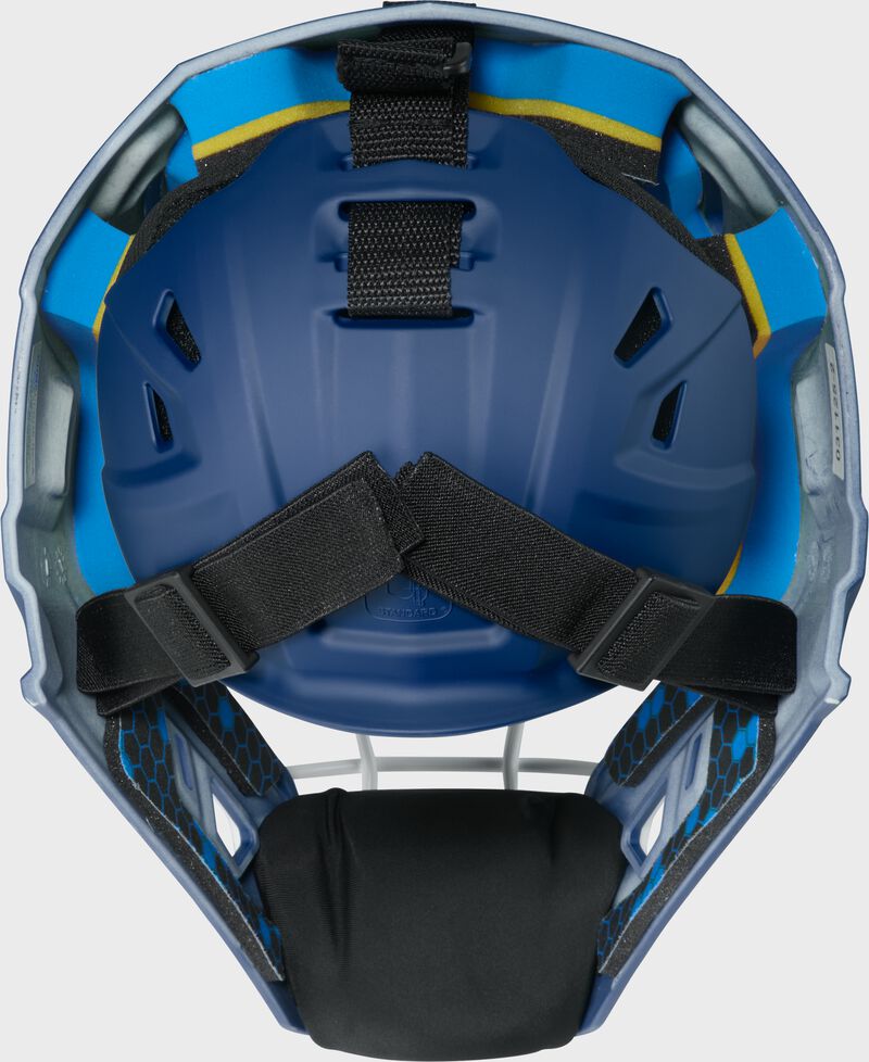 Back of a navy Rawlings Mach Pro Series catcher's helmet