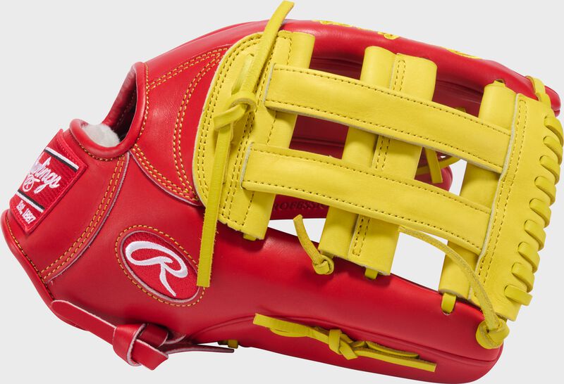 Thumb of a scarlet Rawlings Pro Preferred 12.75" outfield glove with a yellow H-web