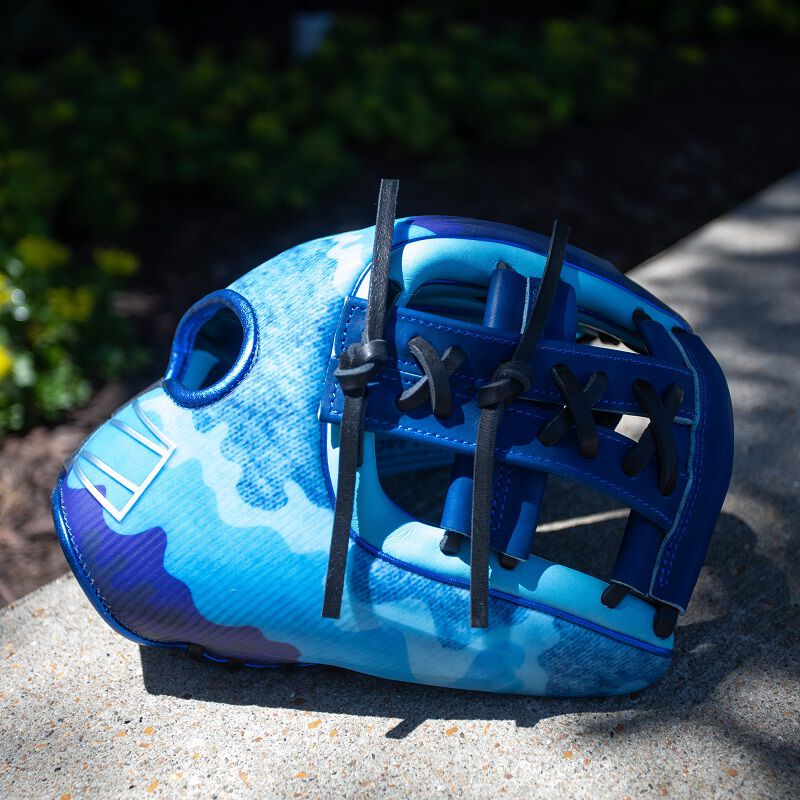 Picture of the thumb side of a blue Limited Edition Father's Day REV1X sitting on concrete
