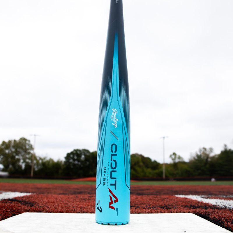 A blue Clout AI BBCOR bat standing on its end on top of home plate loading=