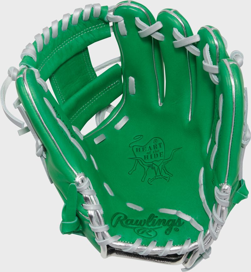 Palm of a Rawlings Heart of the Hide kelly green 11.5" infield glove with silver laces