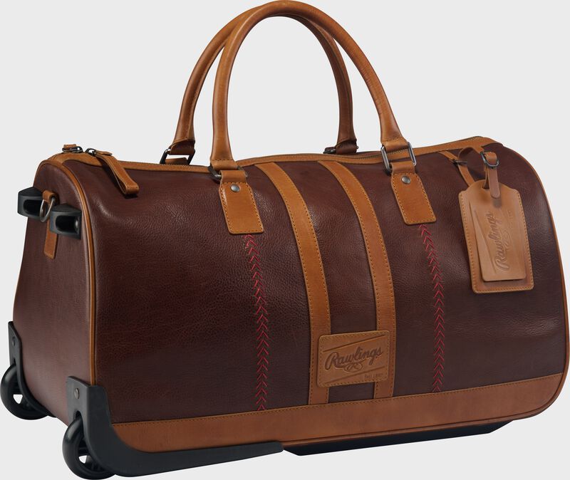 Angle view of a brown Rawlings Heritage Wheeled Duffle Trolley Bag loading=