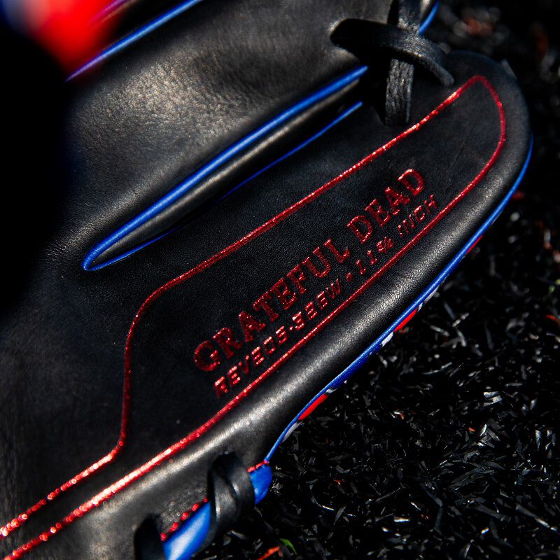 Grateful Dead stamped in red on the pinky of a Rawlings Grateful Dead REV1X glove