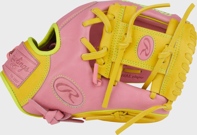 Pink thumb of a Heart of the Hide ContoUR Fit 11.5-Inch ink infield glove with a yellow Pro I-web