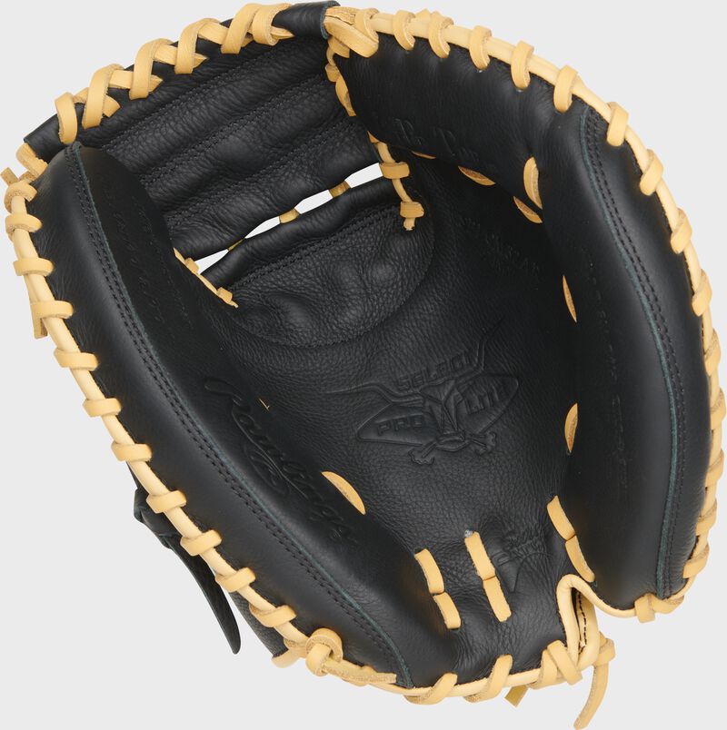 Black palm of a Rawlings Adley Rutshman Select Pro Lite 32" Catcher's Mitt with camel laces loading=