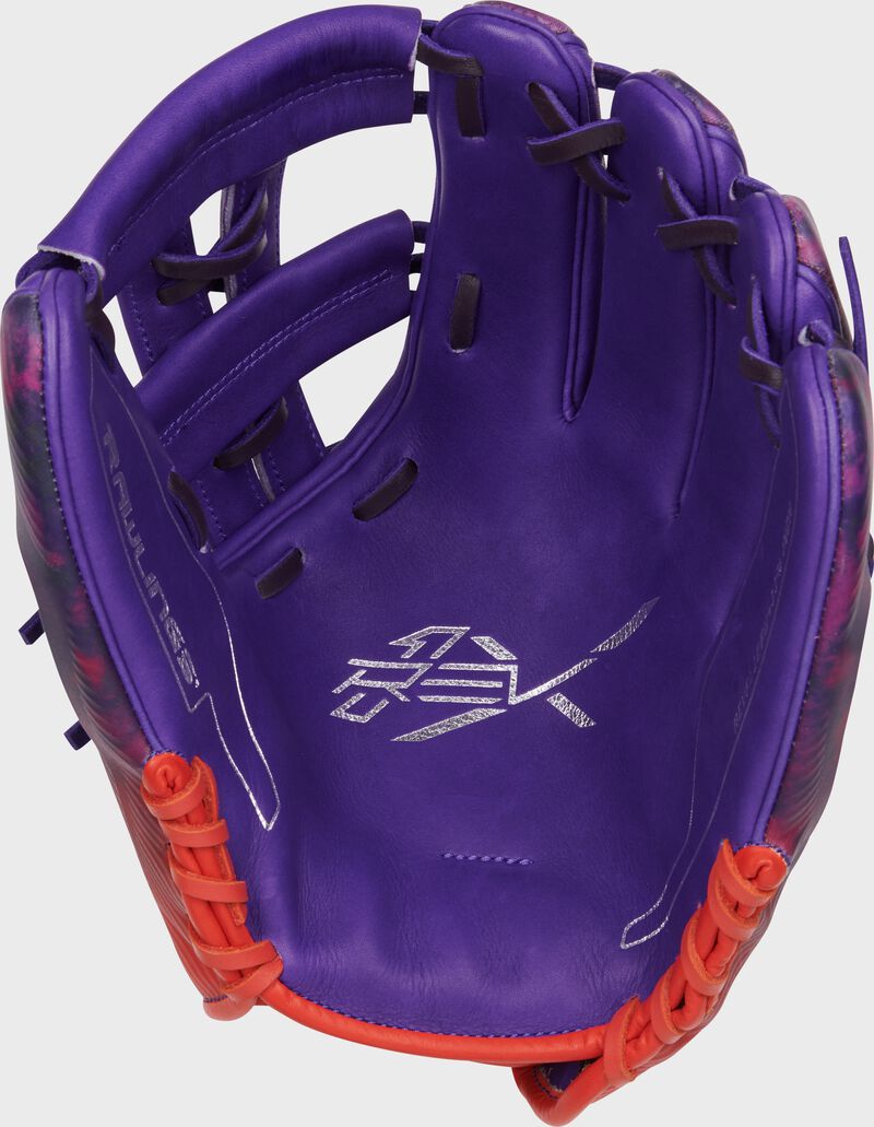Purple palm of a Rawlings Francisco Lindor REV1X glove with navy laces loading=