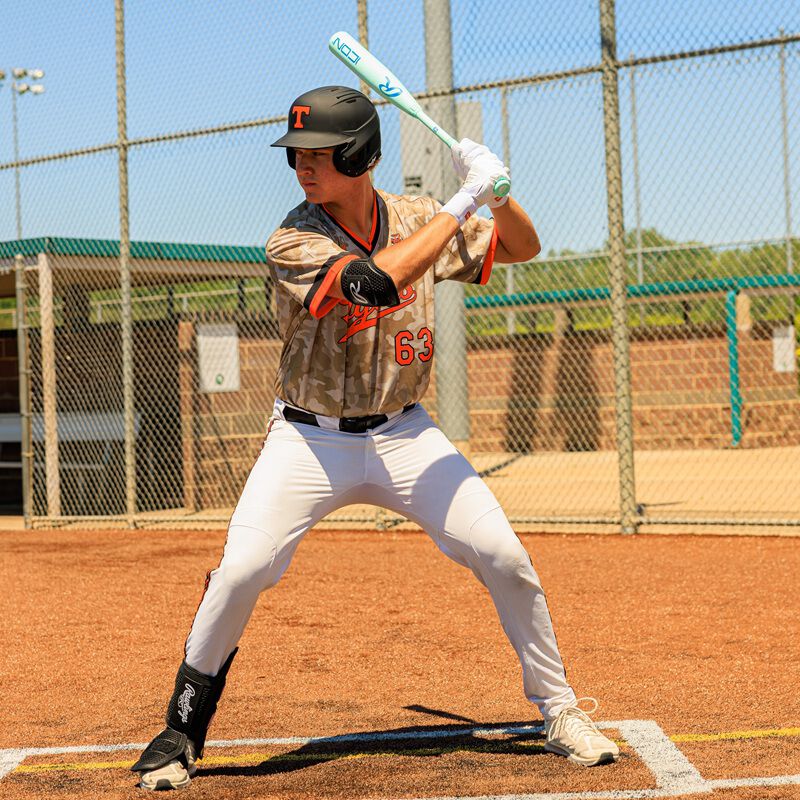 Picture of a player in his batting stance with a 2026 Rawlings Icon BBCOR bat