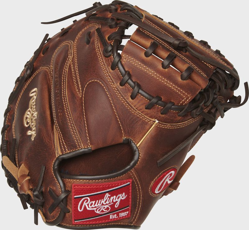 Chocolate back of a 33" Heritage Pro catcher's mitt with a red Rawlings patch - SKU: HPCM33CCH loading=