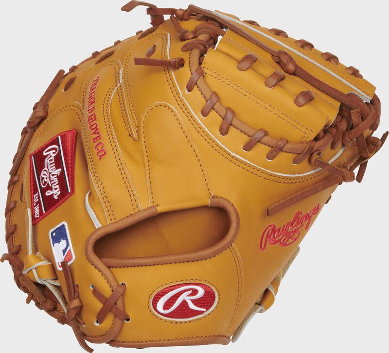 Back of a tan Heart of the Hide 33-Inch catcher's mitt with a red Rawlings patch - SKU: PROCM33T