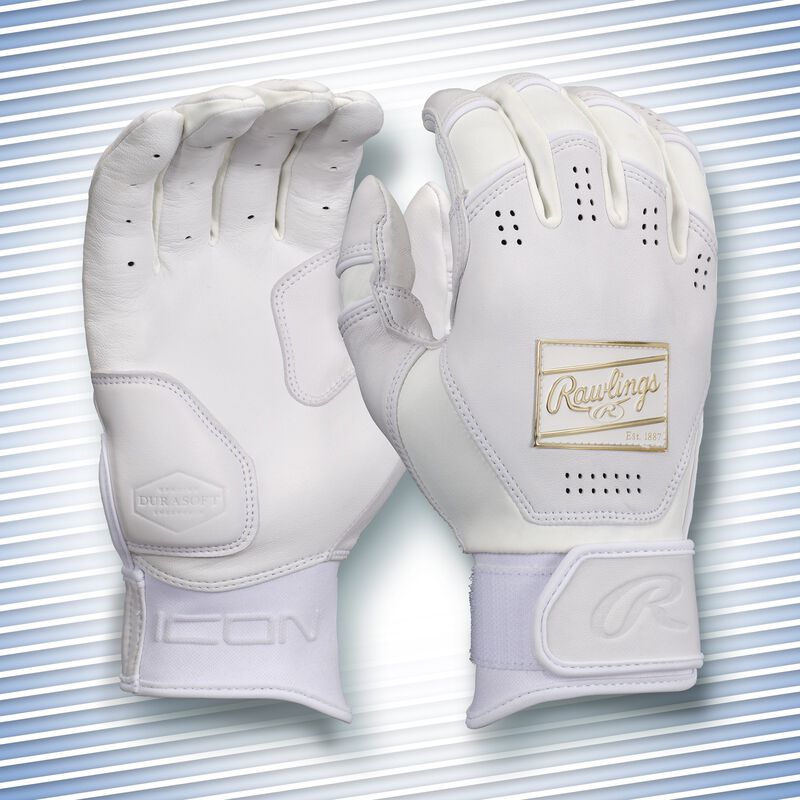 A pair of white Icon batting gloves with a snow theme background