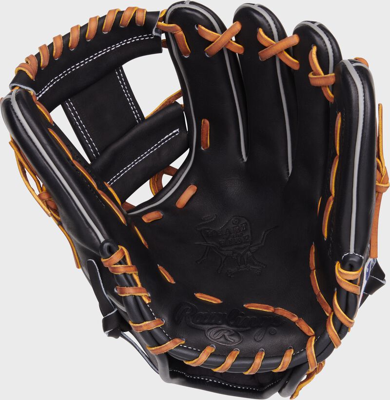 Black palm of a Rawlings Heart of the Hide infield glove with tan laces