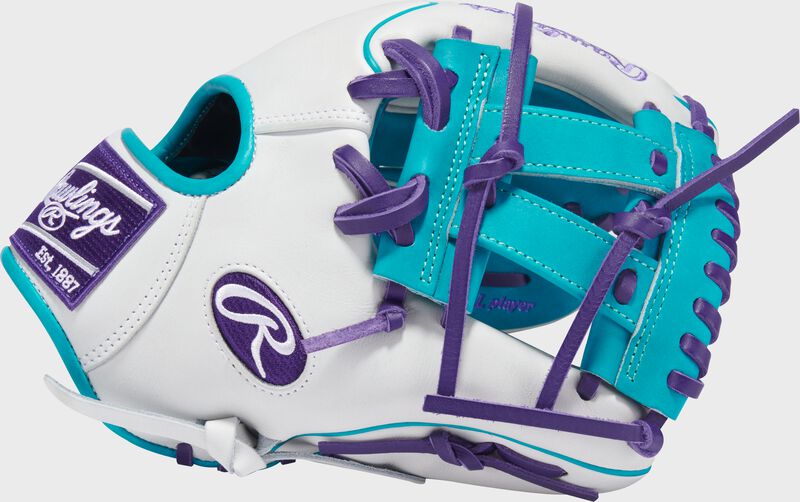 Thumb of a white Exclusive Heart of the Hide R2G Wing Tip 11.5-inch Infield Glove with a teal V-Web
