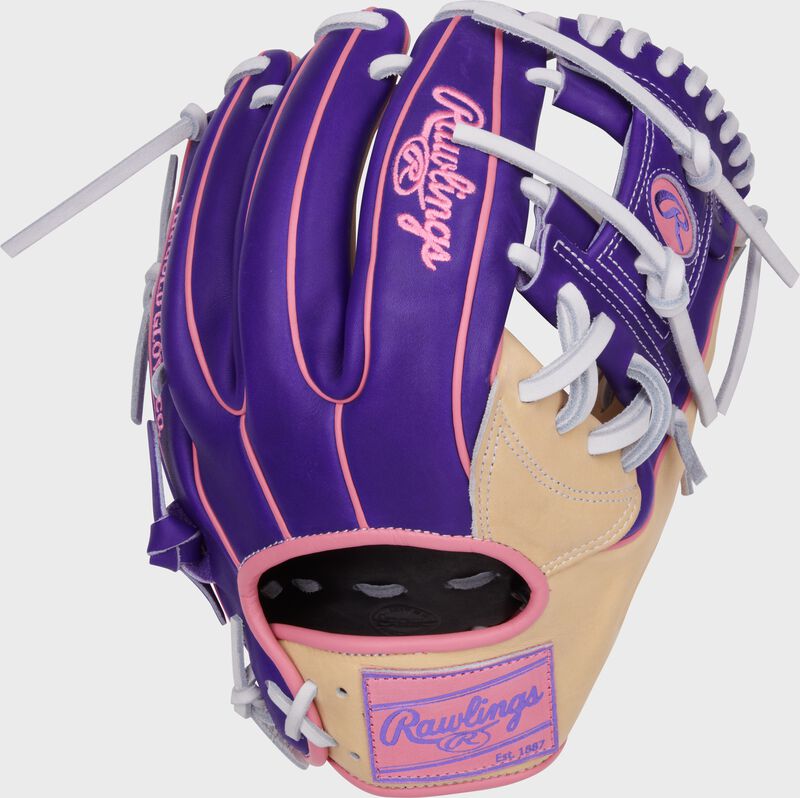 Purple back of a Heart of the Hide Vibrant Series camel/purple 11.5" infield glove with a pink Rawlings patch