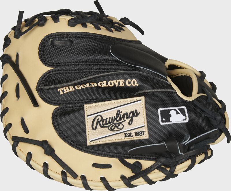 Pinky Side View of the 2021 Heart of the Hide 34-inch catcher's mitt. Features Yadier Molina color pattern